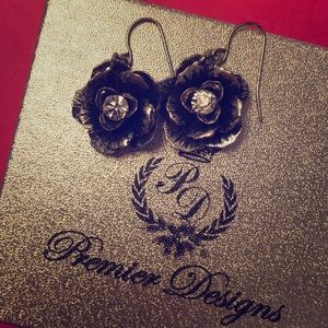 Premier designs silver flower earrings with gem.